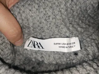 Jersey corto de punto gris con flecos