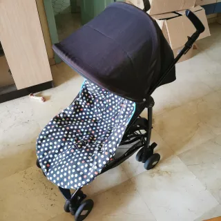 Carrito de bebé a rayas marca  peg-pérego + funda