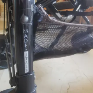 Carrito de bebé a rayas marca  peg-pérego + funda