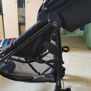 Carrito de bebé a rayas marca  peg-pérego + funda