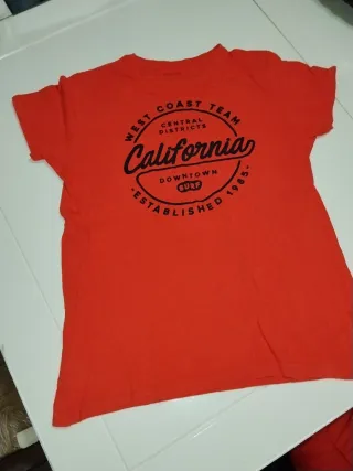 Camiseta Rebel by Primark rosa 11-12 años y Polito