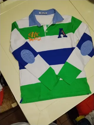 Camiseta Rebel by Primark rosa 11-12 años y Polito