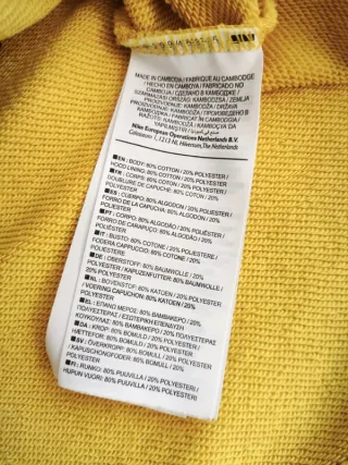 Chándal Nike con capucha y cremallera amarillo