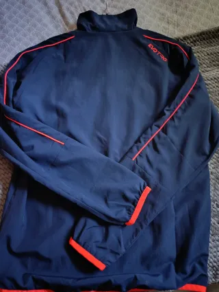 Chaqueta deportiva Puma azul y naranja