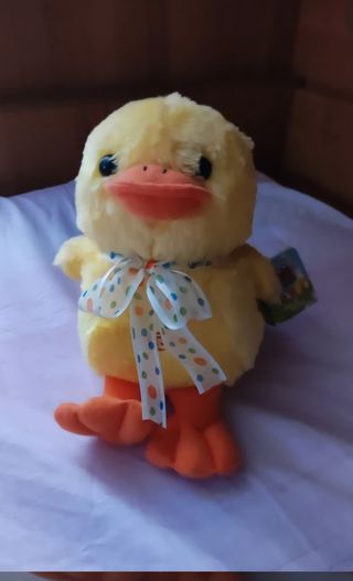 Peluche anatra gialla con fiocco