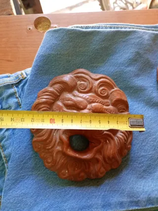 Scultura in terracotta con volto