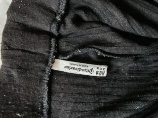Pantalón negro de canalé con cinturón