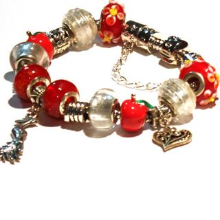 Pulsera Charm Corazón manzana y Ave del Paraíso