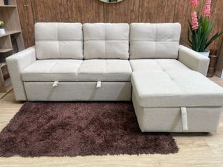 Sofá cama beige con arcón