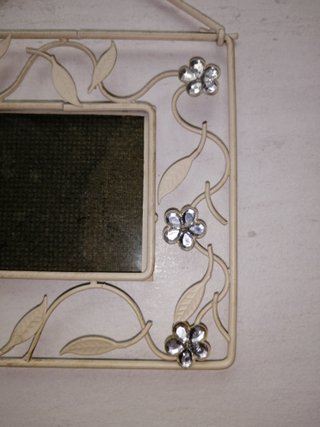 Cornice in ferro decorata con fiori
