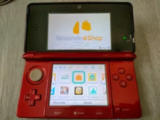 Nintendo 3DS rosso metallico con caricatore