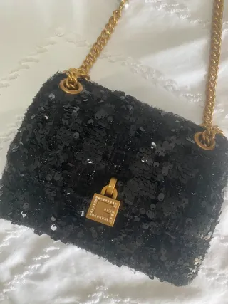 Bolso Guess lentejuelas negro y dorado