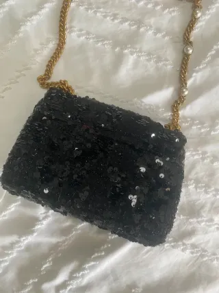 Bolso Guess lentejuelas negro y dorado