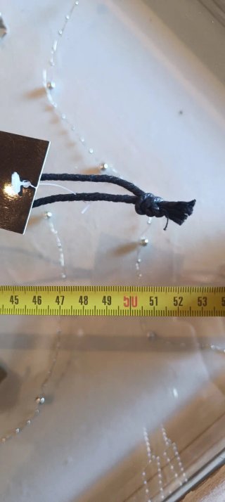 Collana FACIT con pom pom nero e cerchio oro