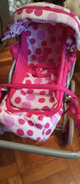 Cochecito de muñecas rosa