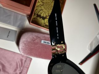 Occhiali da sole Miu Miu neri e oro