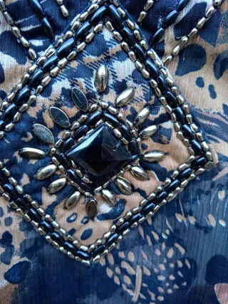 4 BLUSAS ESTAMPADAS DISTINTAS TALLAS:1X2,5€