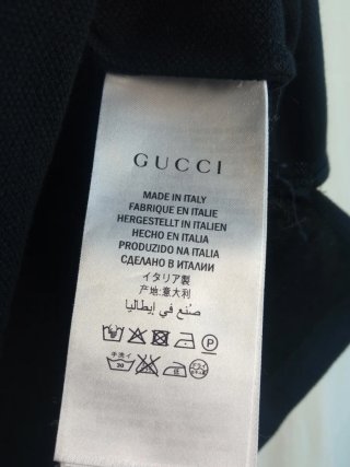 Polo Gucci nero con stemma