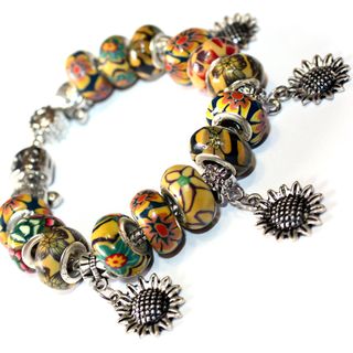 Pulsera con dijes de girasoles y cuentas de fimo
