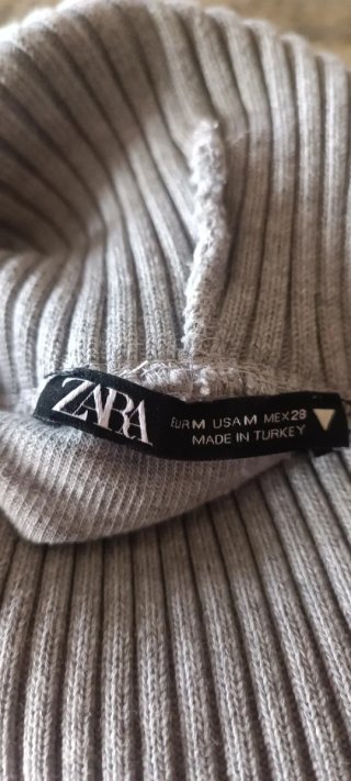 Jersey cuello alto sin mangas gris