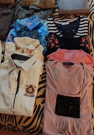 Consegna di abbigliamento donna vario taglia m