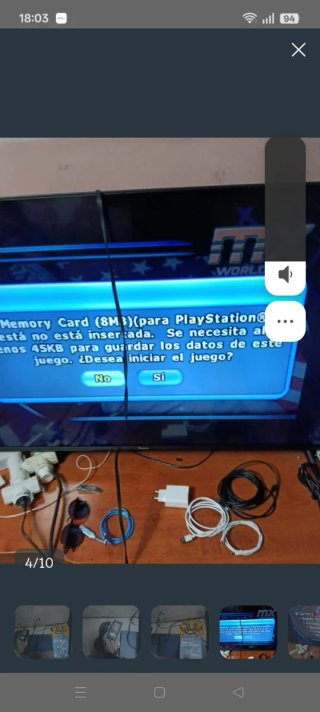 PlayStation 2 con controller di gioco e alimentatore