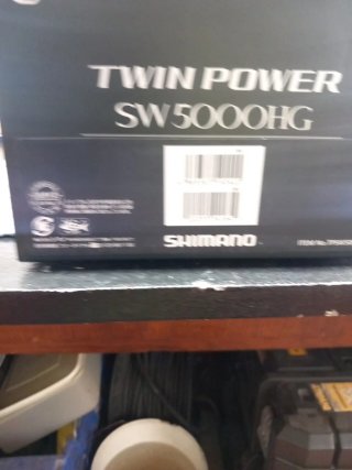 Caña de pescar Daiwa con carete Shimano Twin Power