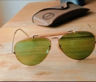 Gafas de sol Ray Ban USA doradas y verdes