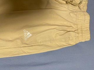 Pantalón impermeable Adidas beige mujer