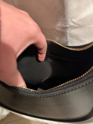 Borsa nera con manico rigido