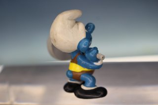 Figura PVC. Pitufo Olimpiadas Halterofilia, pesas. 40507.