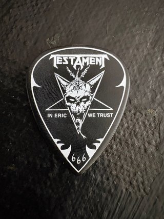 Púa de guitarra Testament