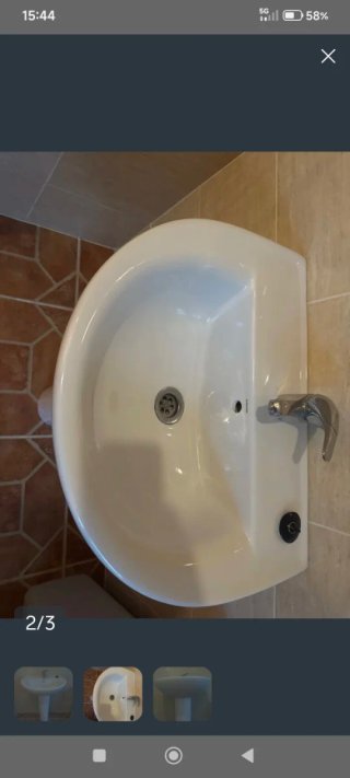 Lavabo redondo con grifería