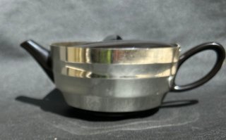 Tetera de cerámica con funda termica