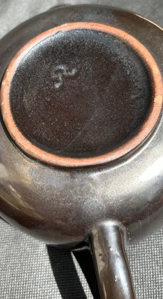 Tetera de cerámica con funda termica