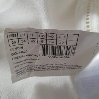 Blusa Naf Naf blanca sin mangas