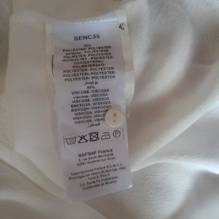 Blusa Naf Naf blanca sin mangas