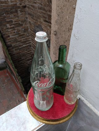 Collezione di bottiglie Coca Cola retrò