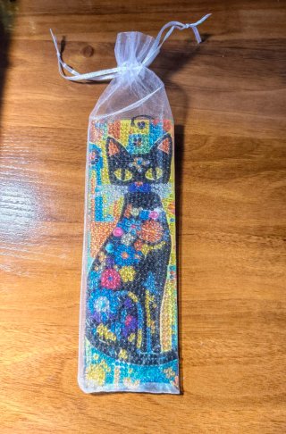 Segnalibri gatti con sfere a taglio diamantato.