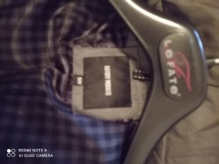 Giubbino trapuntato grigio con fibbia