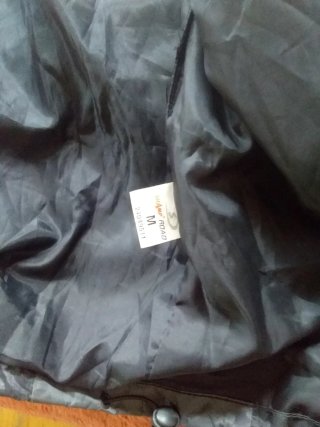 Chubasquera moto negra y gris .en aguilas