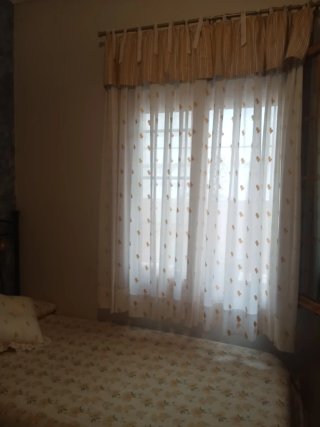 Dos edredones y cortinas