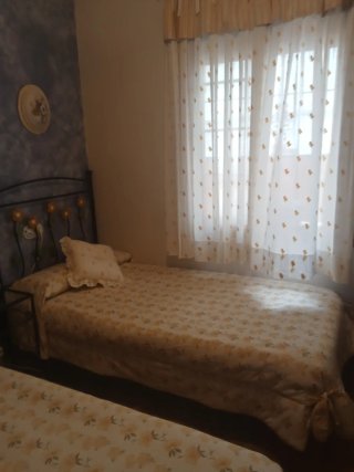 Dos edredones y cortinas