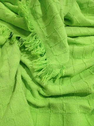 Manta verde con flecos Cubre sofá