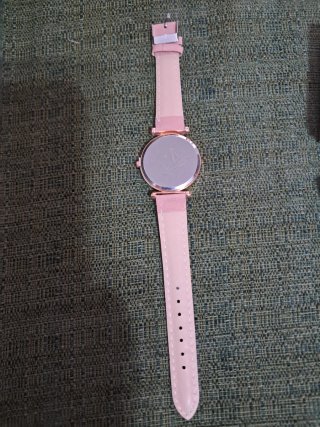 Reloj de mujer dorado y rosa
