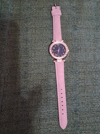 Reloj de mujer dorado y rosa