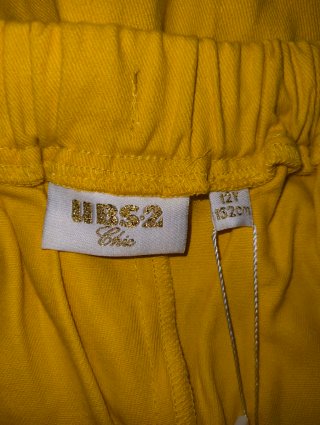 Falda pantalón de niña color mostaza con lazo