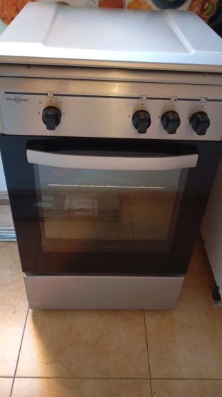 Cocina gas ciudad/butano 4 fuegos. Horno sin uso