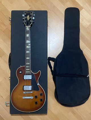 Guitarra Arirang Les Paul + funda y maleta