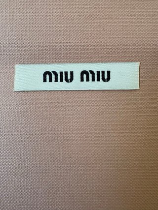 Busta Miu Miu  con fiocco